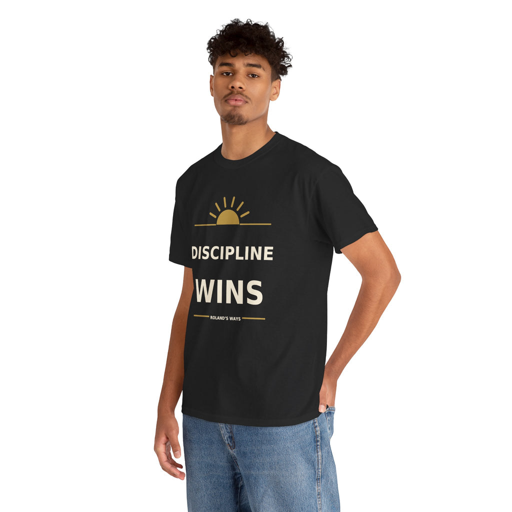 Three-quarter view of a model wearing the black Discipline Wins T-shirt with blue jeans.