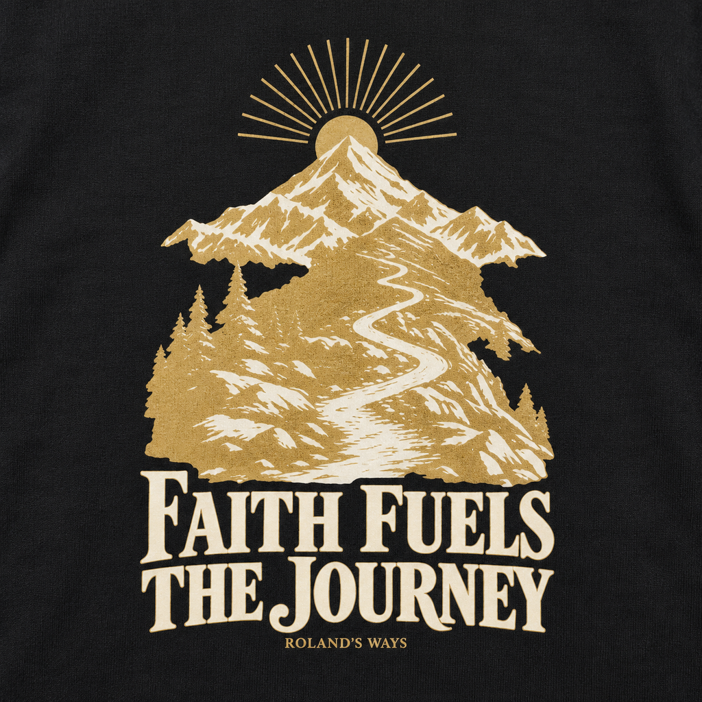 AI close-up mockup of the mountain artwork and slogan on the black Faith Fuels the Journey T-shirt with gold and ivory mountain artwork.