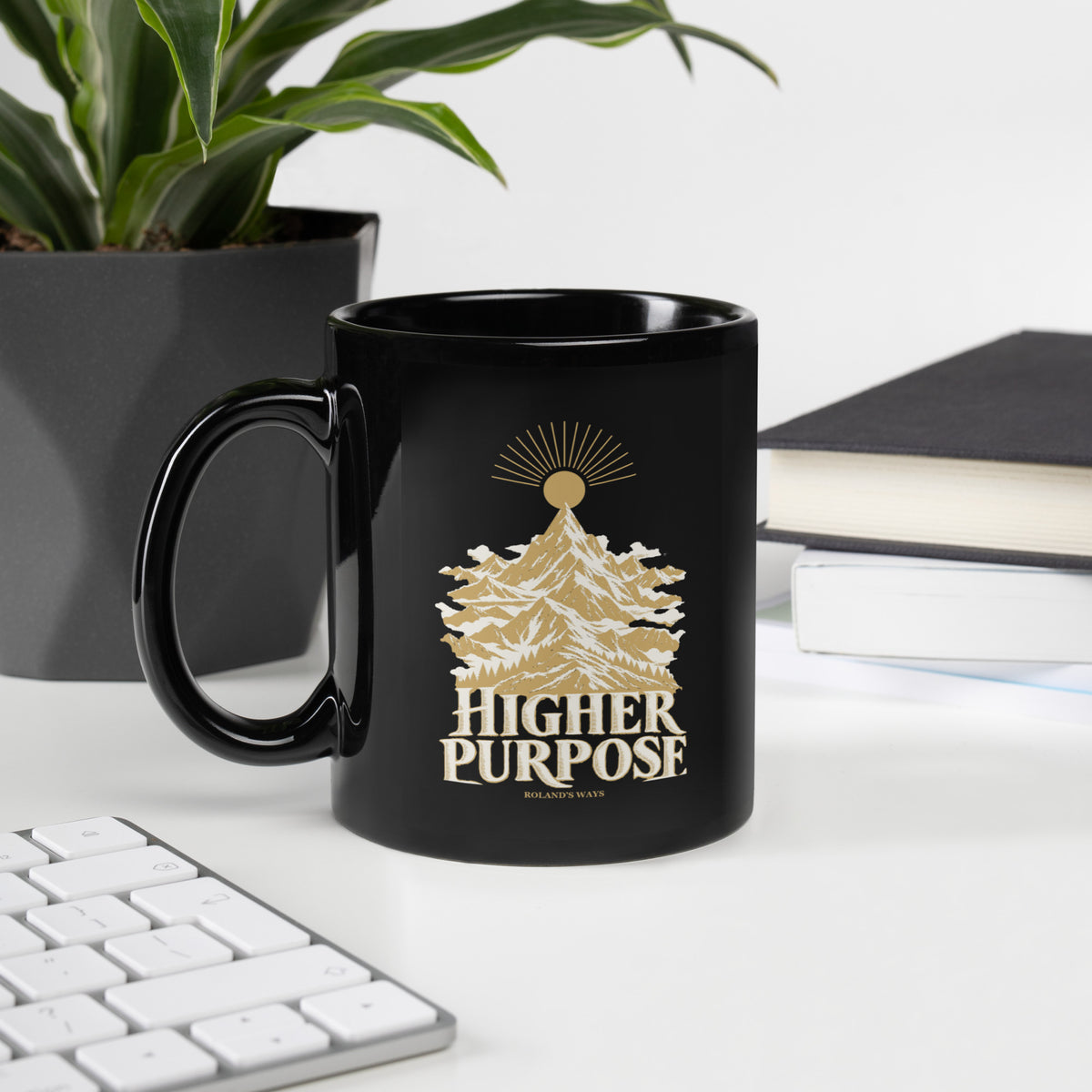 Higher Purpose Black Glossy Mug in black, with handle on the left with gold and ivory Journey artwork.