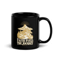 Faith Fuels the Journey Black Glossy Mug in black, with handle on the right with gold and ivory Journey artwork.