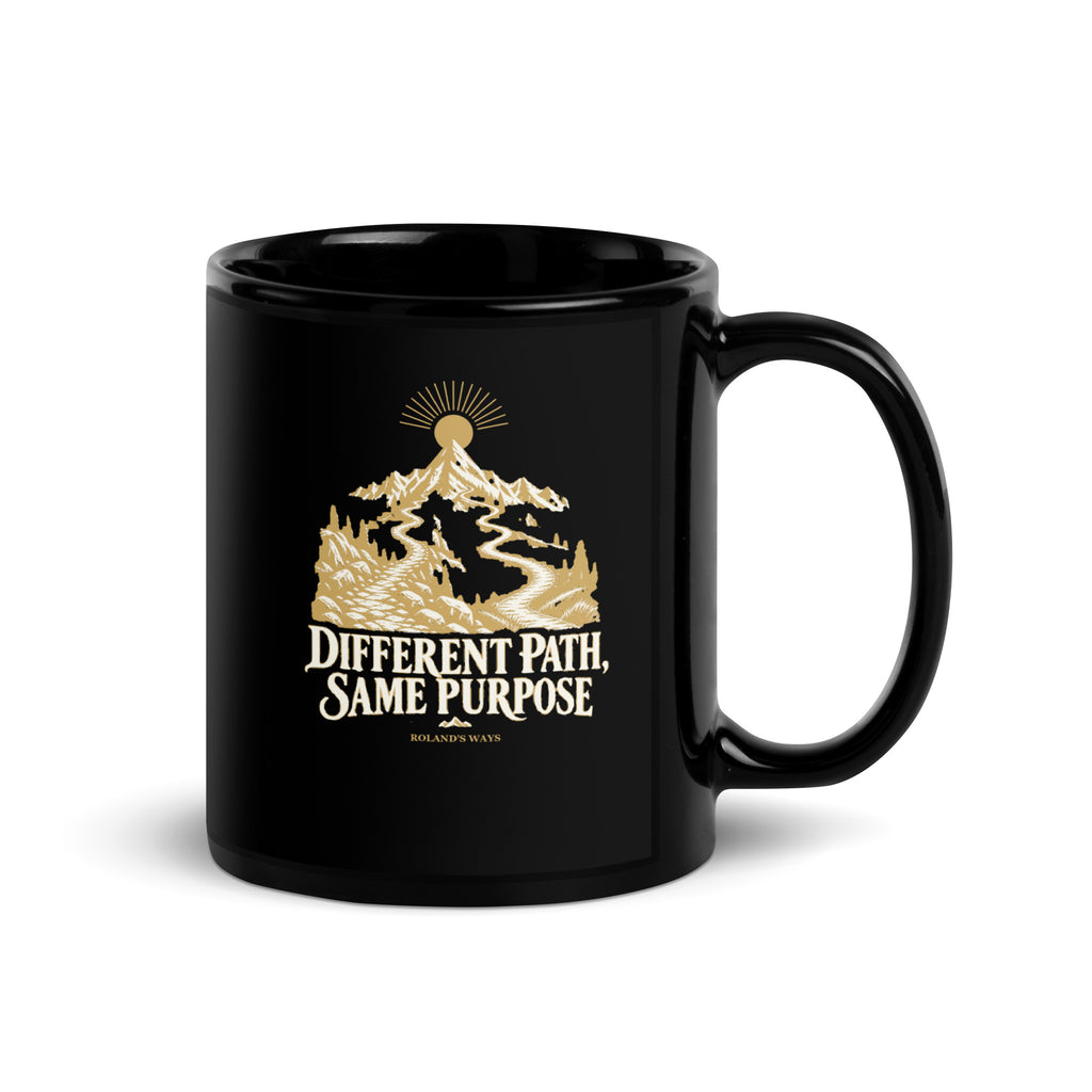 Different Path, Same Purpose Black Glossy Mug in black, with handle on the right with gold and ivory Journey artwork.
