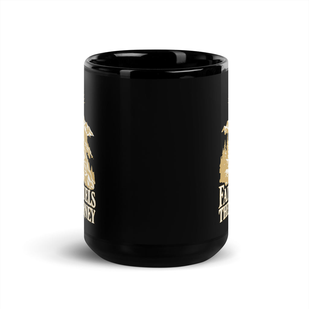 Faith Fuels the Journey Black Glossy Mug in black, front view with gold and ivory Journey artwork.