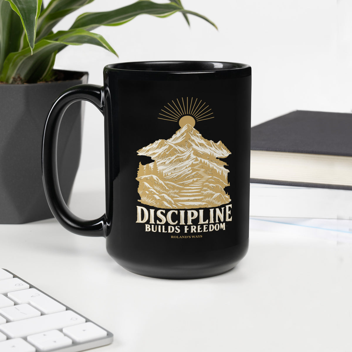 Discipline Builds Freedom Black Glossy Mug in black, with handle on the left with gold and ivory Journey artwork.