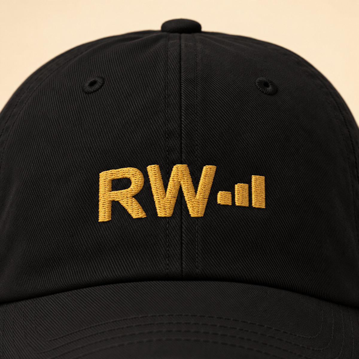 Roland’s Ways signature black embroidered hat — embroidery closeup; digital mockup