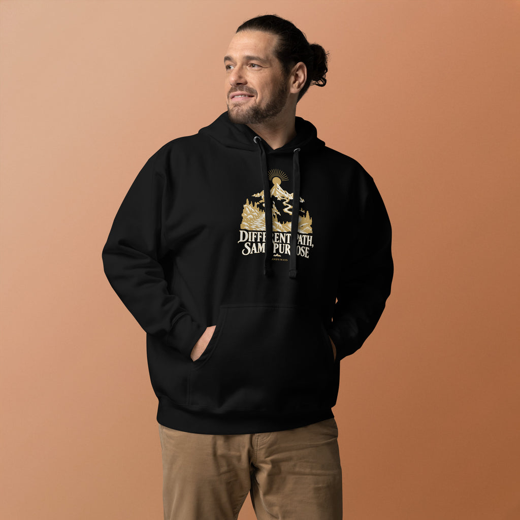 Different Path, Same Purpose Premium Hoodie in black, front view with gold and ivory Journey artwork.